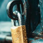 close up photography of wet padlock